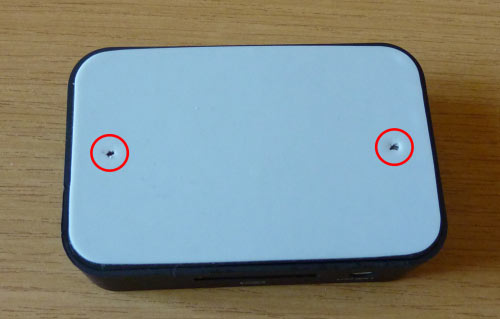 Location of the screws on the bottom of the iPhone dock